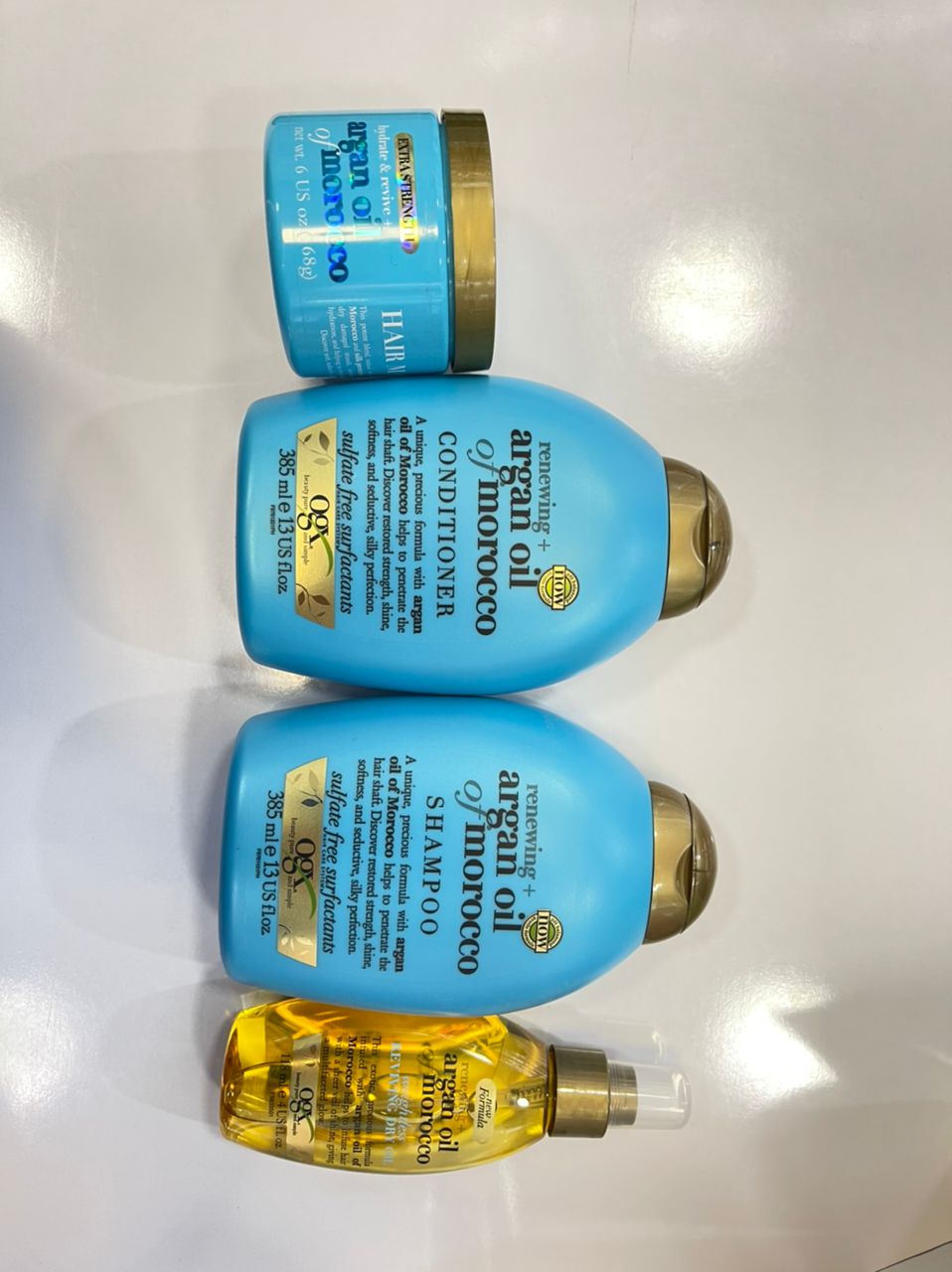 پک محصولات روغن آرگان مراکش اوجی ایکس OGX | شامپو، نرم کننده، ماسک مو و اسپری روغن آرگان